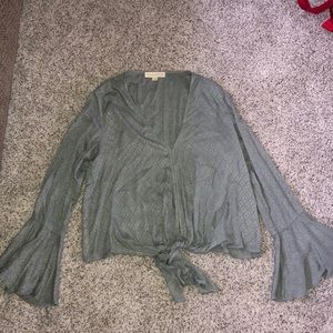 A green long sleeve top